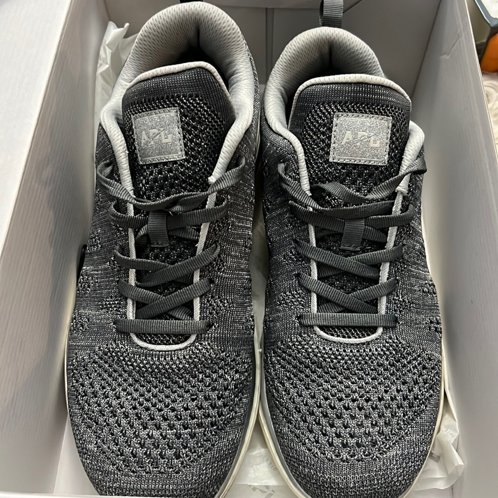 Lululemon dark gray with silver APL Tech Loom athletic shoes.